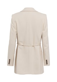Beige tailored blazer with a fitted waist, long sleeves, and four brown button accents on each cuff. Smooth, textured fabric, mid-length design.