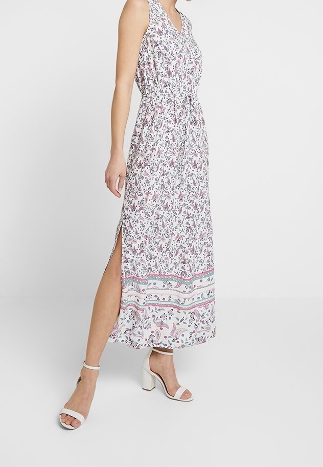 Robe longue à imprimé floral, sans manches, col en V, taille élastique, fentes latérales et ourlet à motifs. Couleurs : blanc, rose et vert.