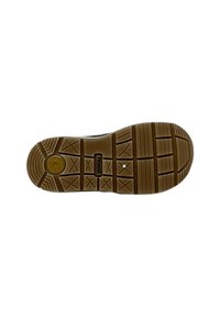 Sole in gomma con motivi testurizzati per la presa, caratterizzata da un logo circolare e da branding. Bordo arrotondato con battistrada visibile per migliorare la trazione.