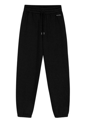 Pantaloni della tuta neri con cinturino elastico in vita e cordino. Caviglie arricciate e un piccolo logo del marchio nella parte superiore sinistra.