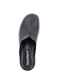 Black leather clog featuring a smooth texture, rounded toe, and open back for easy slip-on wear. Brand logo visible on the insole.