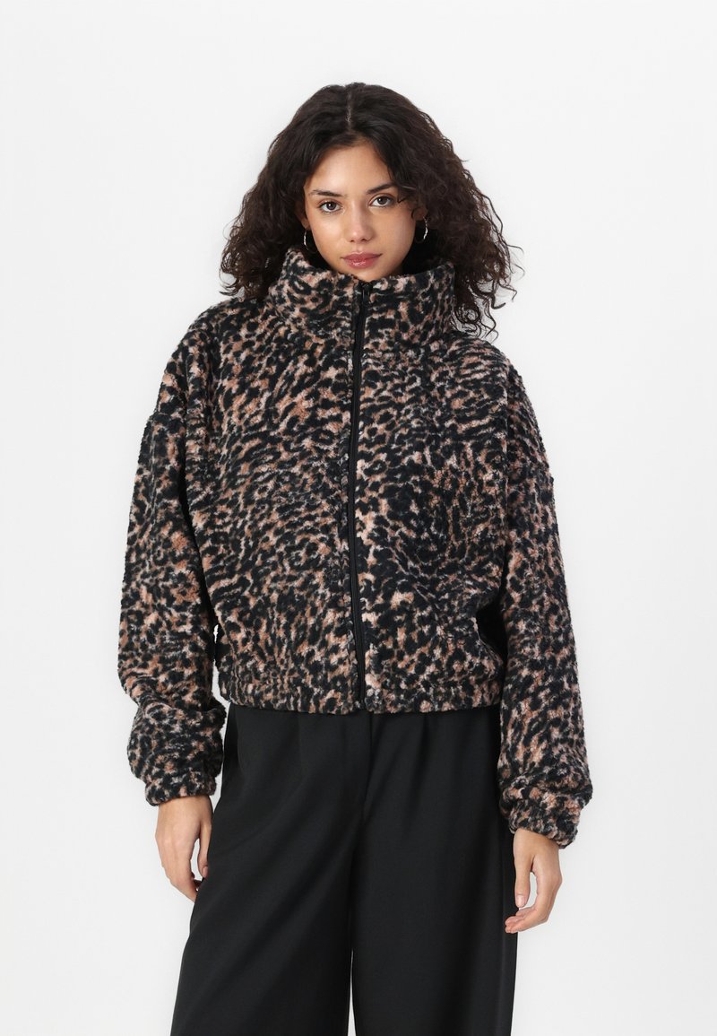 Fleece zip-up jacket featuring a black and peach leopard print, high collar, relaxed fit, and elasticized cuffs.