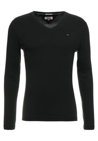 Schwarzes Langarmshirt mit V-Ausschnitt aus weichem Stoff; verfügt über ein kleines Logo auf der Brust und hat eine taillierte Passform.