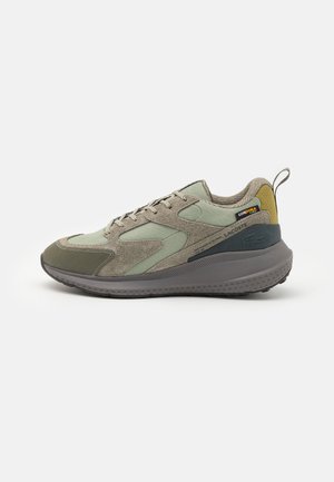 Green and grey athletic shoes featuring a mix of mesh and suede materials, textured outsole, and a pull tab at the heel.
