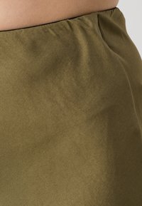 DRYKORN URA - A-silueta svārki - green