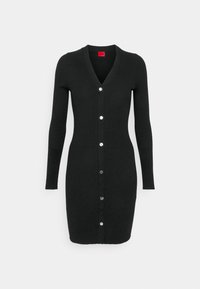 Abito cardigan nero a costine con maniche lunghe, scollatura a V e bottoni argentati lungo la parte anteriore. Tessuto liscio, forma aderente e lunghezza al ginocchio.