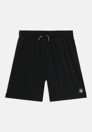 Crne kratke hlače srednje duljine s elastičnim pojasom i žutim vezicama, s malim logom Converse All Star na donjem lijevom nožnom dijelu.