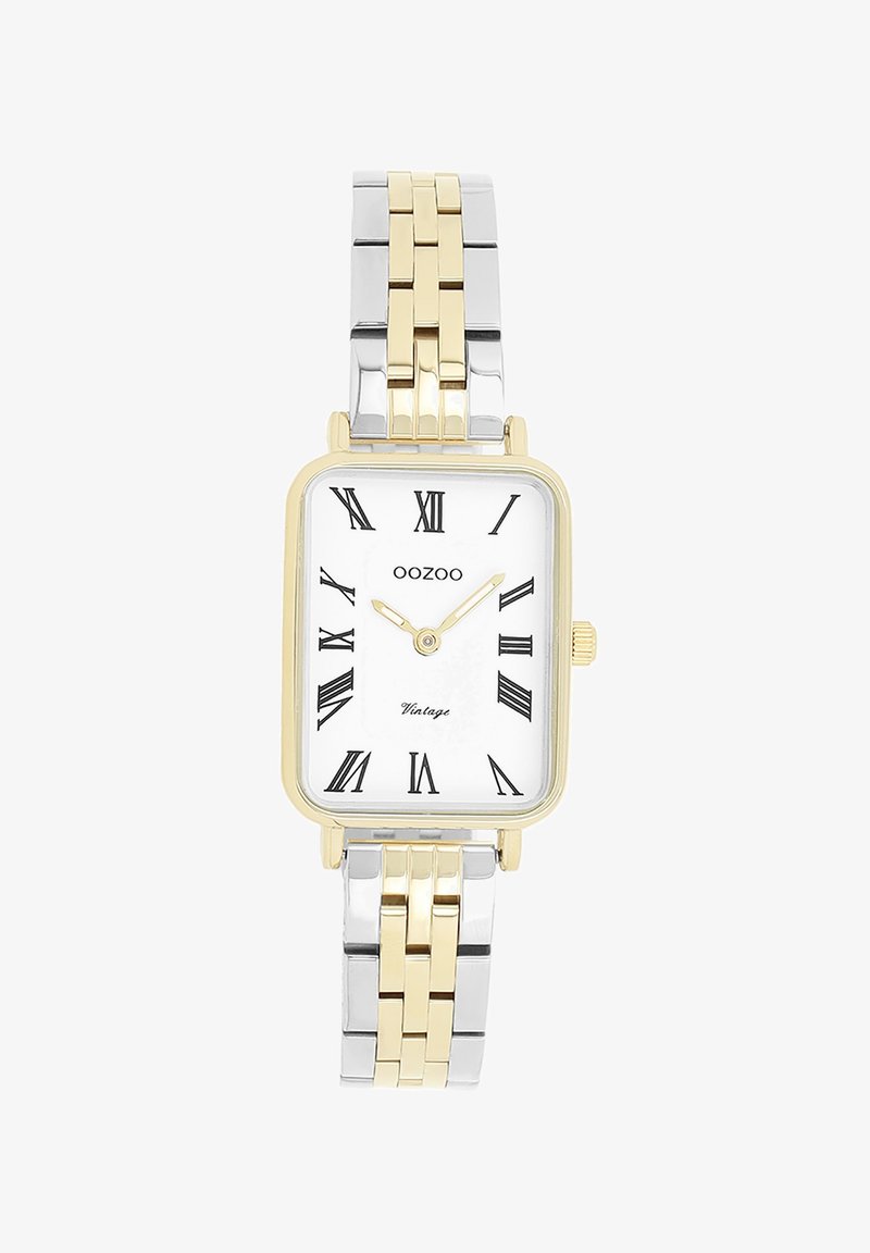 Montre rectangulaire en or et argent avec un cadran blanc, des chiffres romains noirs et un bracelet en métal bicolore. Marque : Oozoo.
