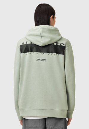 Mintgroene hoodie met een capuchon, zwarte horizontale baan over de achterkant met tekst, geribbelde manchetten en een relaxte pasvorm.