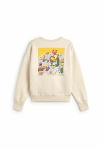 Sweat-shirt beige avec un imprimé coloré d'une table dressée avec du pain, du fromage, du vin, des fruits et divers aliments dans le dos.