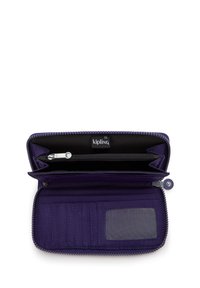 Purple zip-around wallet open, showing multiple card slots, a transparent ID window, and a zippered coin compartment with Kipling brand label.