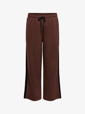 Ruskeat verkkarit rentolla istuvuudella, joissa on joustava vyötärönauha nyörillä, mustat sivupaneelit ja pehmeä teksturoidu kangas.