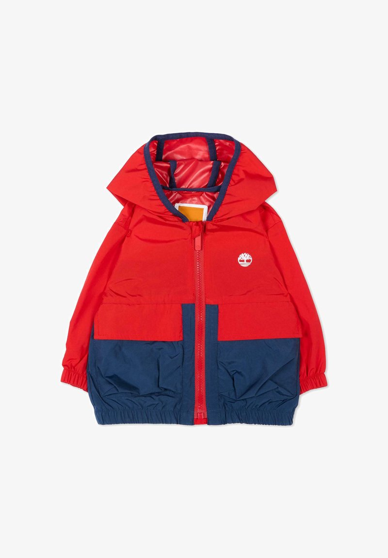 Veste à capuche pour enfants rouge et bleu marine avec fermeture éclair à l'avant, poignets élastiques, deux poches avant et logo d'arbre blanc sur la poitrine.
