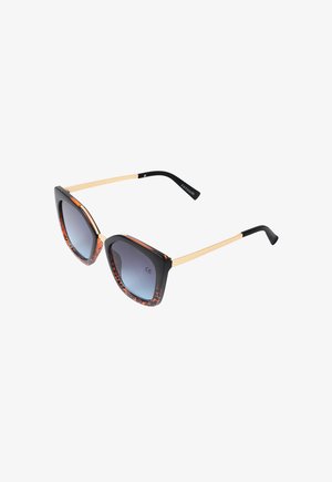 Cateye-Sonnenbrille mit einem schwarz und schildpattfarbenen Rahmen, verlaufenden Gläsern, Metallarmen und strukturierten Akzenten. Sie verfügt über ein auffälliges, geometrisches Design.