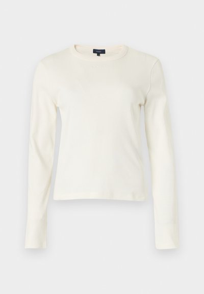 Μπλούζα μακρυμάνικη σε κρεμ απόχρωση από μαλακό ύφασμα με στρογγυλή λαιμόκοψη και μινιμαλιστικό σχέδιο. Δεν έχει ορατά σχέδια ή διακοσμητικά στοιχεία.