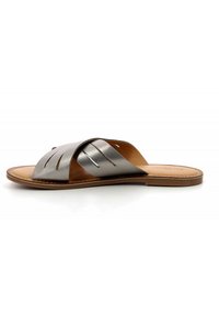 Metallic silver leather slide sandal with three intersecting straps. Light brown leather insole and outsole. Minimalist design with no embellishments.