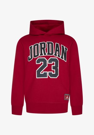 Rode hoodie met "JORDAN" en het nummer "23" gedrukt in zwart en wit. Beschikt over een label met het Jordan-logo aan de onderkant.