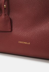 Coccinelle KLICHE  - Geantă de mână - bordeaux