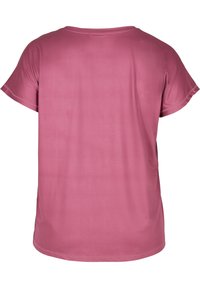 T-shirt z krótkim rękawem i okrągłym dekoltem w jednolitym różowym kolorze. Wykonany z gładkiej tkaniny o luźnym kroju i subtelnych szwach. Bez widocznych wzorów ani akcentów.