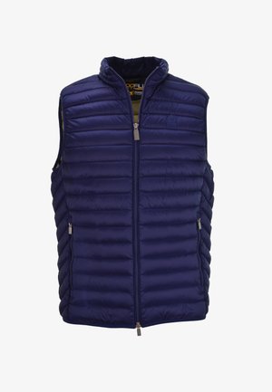 Mørkeblå pufvest med høj krave, vandret quiltet design, foran lynlåse og to sidelommer. Har et logo på brystet.