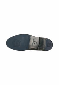 Suola di scarpa in pelle nera con una finitura liscia, caratterizzata da un motivo in rilievo e dettagli del logo. Il tacco è strutturato e leggermente elevato.