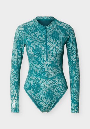 Ολόσωμο μαγιό με μακριά μανίκια σε χρώμα πετρόλ, με φερμουάρ μπροστά και ελαφρύ τροπικό φύλλωμα και λουλουδένιο μοτίβο.