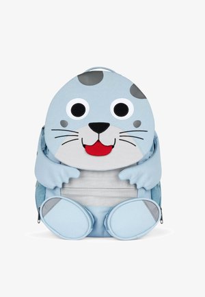 Child-sized blue backpack designed as a seal; features large eyes, stitched mouth, and flipper arms; made of soft fabric with a zip pocket.