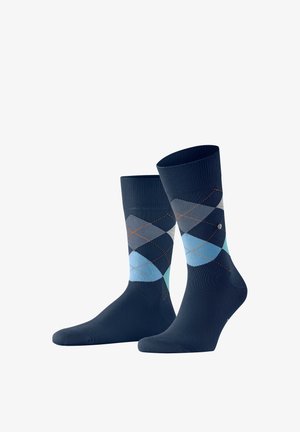 Donkerblauwe sokken met een ruitpatroon in tinten blauw en grijs, met oranje stikseldetails.