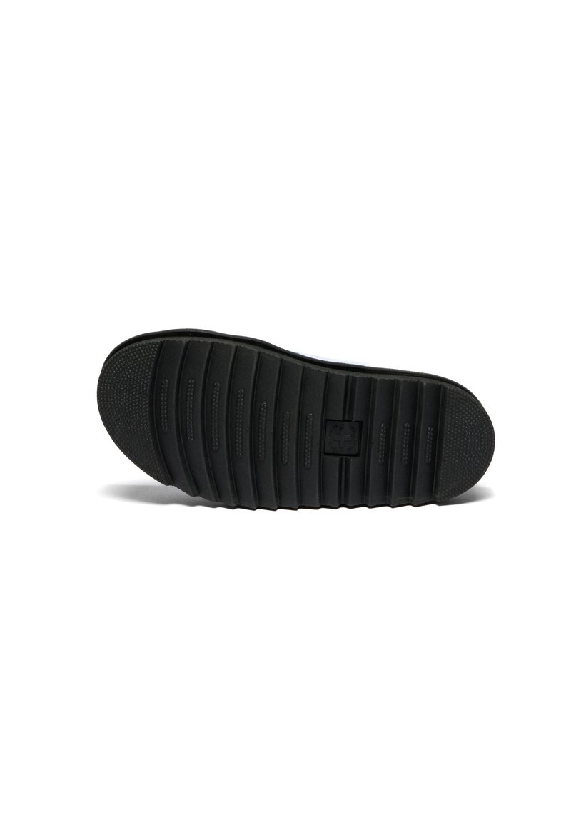 Black shoe sole with deep horizontal grooves and textured toe and heel areas on a white background.