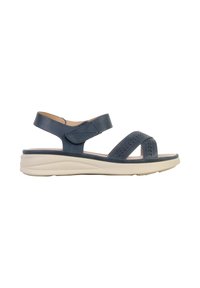 Sandale bleu marine à bout ouvert avec bride de cheville ajustable et semelle beige rembourrée conçue pour le confort et une tenue décontractée.