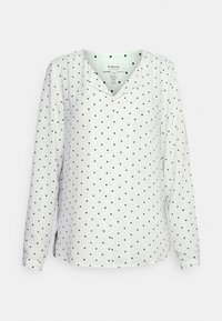 Weißes Langarmshirt mit navyfarbenen Punkten, V-Ausschnitt und Knopfleiste. Glattes Fabric mit leichtem Glanz und seitlichen Schlitzen für mehr Bewegungsfreiheit.