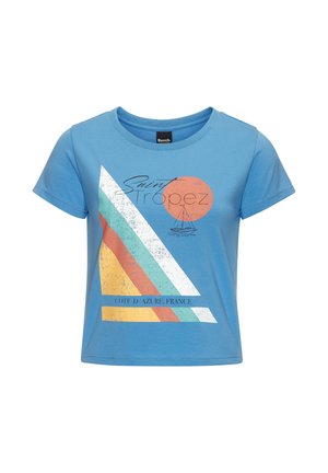 Blue short-sleeve crop top with graphic of sailboat, orange sun, multicolor stripes, and text "Saint Tropez Cote d'Azur, France."