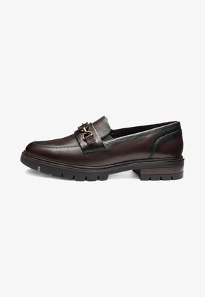 Dark brown leather loafer with metal buckle detail, thick rubber sole, and low stacked heel, shown from the side on white background.