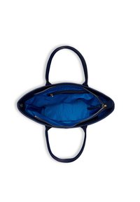 Granatowa torebka z podwójnymi uchwytami, otwarta góra ukazująca przestronną wnętrze wyłożone niebieską tkaniną z kieszenią na zamek wewnątrz.