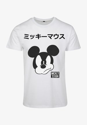 Balta kokvilnas T-kreklu, kurā ir liels melns grafikas attēls ar Mikija Pelītes seju un japāņu teksts augšpusē, ar drukātu "MICKEY MOUSE" etiķeti apakšā.