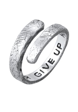 Silver ring with an open design, textured finish, and engraved phrase "NEVER GIVE UP" on the inner band. Minimalist and modern style.