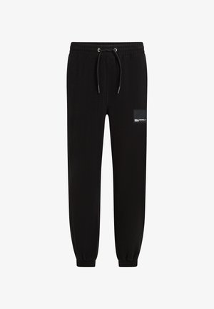 Zwarte sweatpants van zacht materiaal met een elastische tailleband, koord en cuffs aan de enkels; heeft een klein logo op de zij.