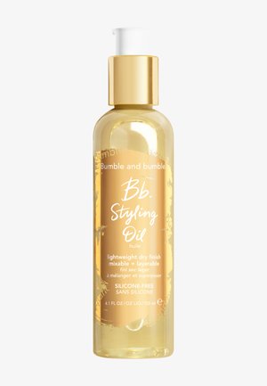 Bumble and bumble Bb. Styling Oil i en klar, rundad glasflaska. Guldpump med topp, guldtryck; silikonfri. Innehåller 120 ml.