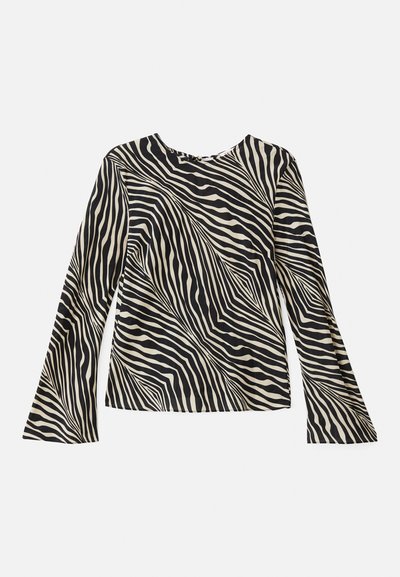 Long-sleeve top featuring a cream and black zebra stripe pattern, round neckline, smooth fabric, and flared sleeves.