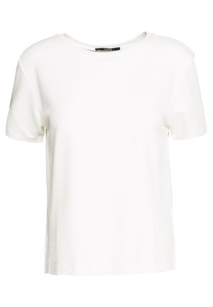 Biały teksturowany krótki top z okrągłym dekoltem i subtelnym pionowym szwem z przodu.