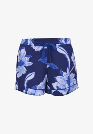 Short bleu marine avec grand imprimé floral blanc et bleu, avec ceinture nouée à l'avant et ourlet retroussé.