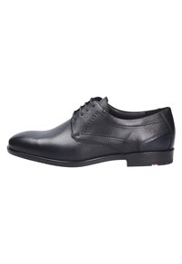 Schwarze Leder-Dressschuhe mit glatter Oberfläche, spitz zulaufender Schuhspitze, genähten Details und flacher Gummisohle. Verfügt über sechs Ösen für die Schnürsenkel.