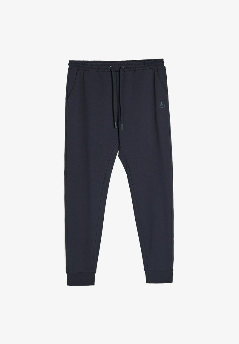 Granatowe dresy wykonane z miękkiego materiału, z elastycznym paskiem w talii i sznurkiem, kieszeniami bocznymi oraz ściągaczami przy nogawkach.