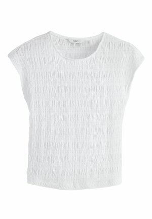 Bílý top s texturovaným povrchem, kulatým výstřihem a mírně zakrytými rameny. Vyroben z měkké látky s volným střihem. Značka: NEXT.