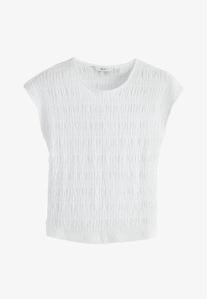 Bílý top s texturovaným povrchem, kulatým výstřihem a mírně zakrytými rameny. Vyroben z měkké látky s volným střihem. Značka: NEXT.