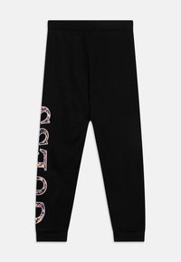 Czarne spodnie dresowe z ribbowym pasem i napisami w kwiatowym wzorze na lewej nodze. Wykonane z miękkiego, elastycznego materiału dla wygody.