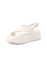 Sandali platform bianchi con cinturini incrociati e design slingback. Realizzati in materiale morbido con una superficie liscia e una suola in gomma resistente.