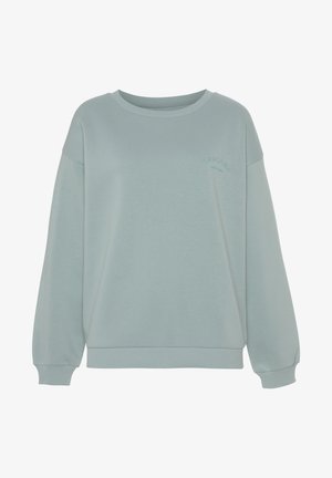 Lichtblauwe sweatshirt met een relaxte fit, geribde ronde hals en lange mouwen. Bevat subtiele branding in donkerder blauw op de borst.