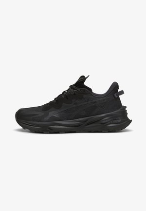Musthave mustmeditsiiniline king, millel on tekstureeritud ülemine osa, mis koosneb võrgust ja kummist detailidest, pehme krae ja paks polsterdatud tall, mis tagab toe.