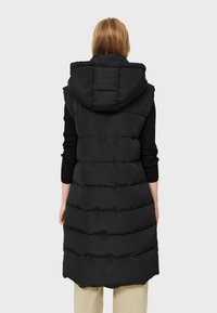 Black puffer vest with a hood, featuring a long, sleeveless design, quilted pattern, and smooth texture.